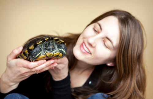 Woman holding a turtle